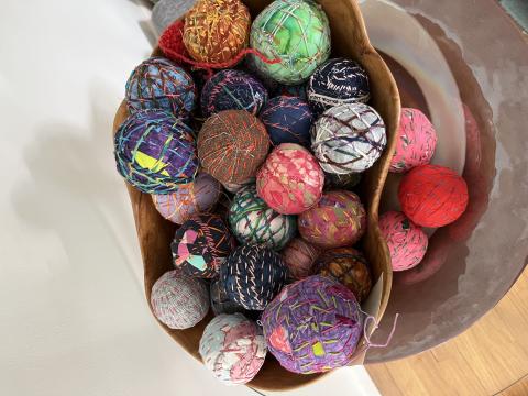 Basket of fabric dryer balls.