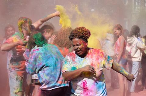 Kids throwing colored powder