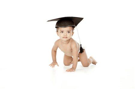 baby wearing graduation cap