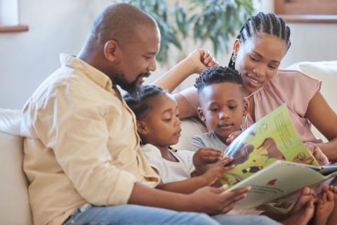 Family reading a book together