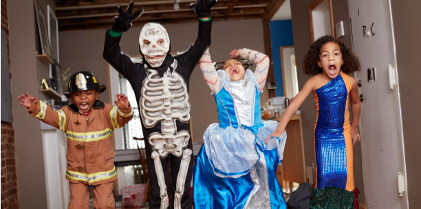 Kids dancing in Halloween costumes