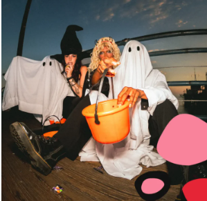 Tweens in Halloween costumes