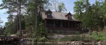 An image of a large and dark lake house.